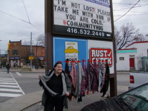 Josie from Master Mechanic Helping out in the community by giving out scarves