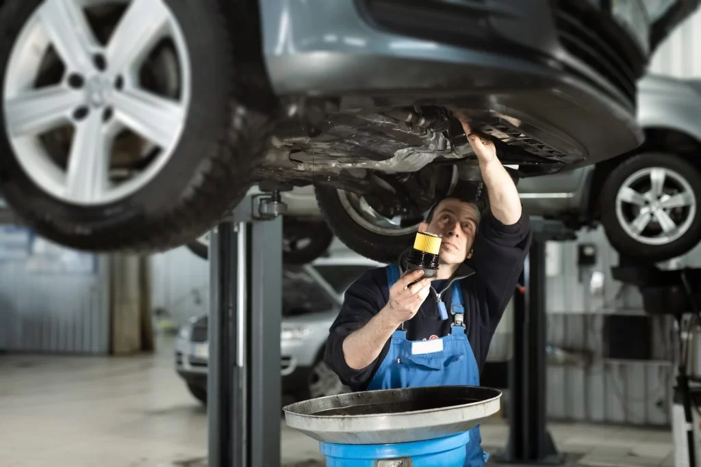 technician performing an oil change