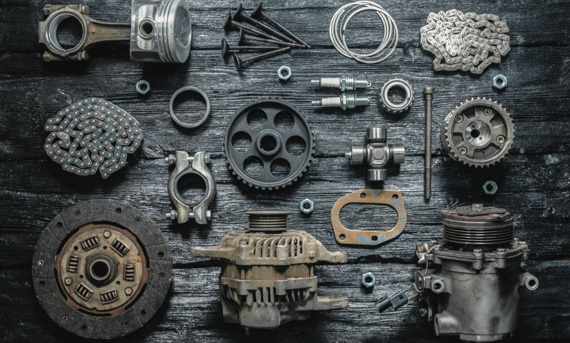 Car parts on a black wooden workbench